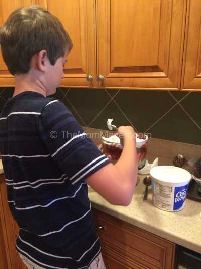 Jacob assembling the strawberry trifle