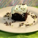 Celebrate on March 17th with this St Patrick's Day Grasshopper Cake. It's an easy-to-make minty poke cake the whole family will enjoy.
