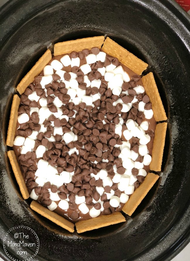 Your family will enjoy the delicious taste of S'mores year round with this easy yet decadent ooey gooey crockpot s'mores cake.