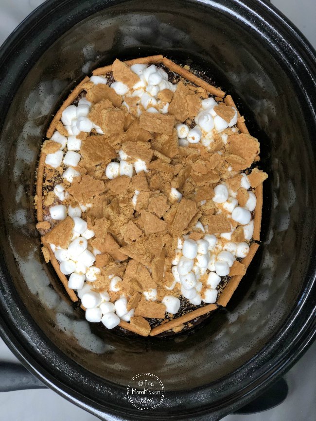Your family will enjoy the delicious taste of S'mores year round with this easy yet decadent ooey gooey crockpot s'mores cake.