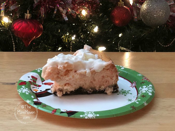 Perfect for any Christmas celebration, this Peppermint Cheesecake recipe has a chocolate graham cracker crust, crushed candy canes in the cheesecake layer, and is topped with whipped cream.