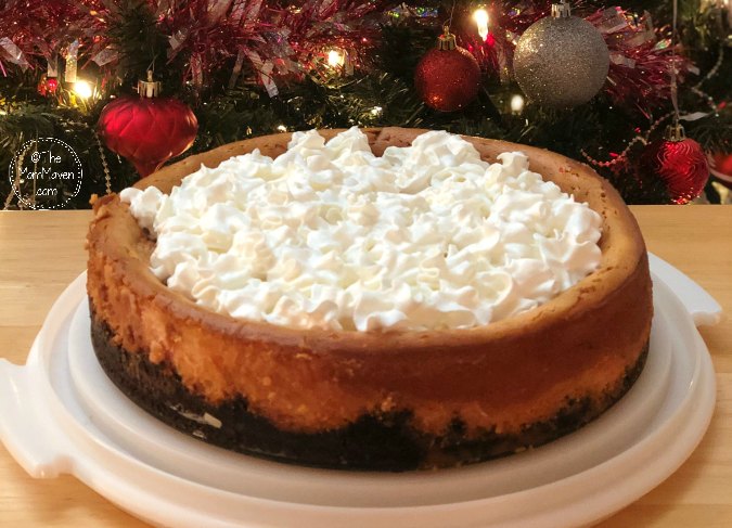 Perfect for any Christmas celebration, this Peppermint Cheesecake recipe has a chocolate graham cracker crust, crushed candy canes in the cheesecake layer, and is topped with whipped cream.