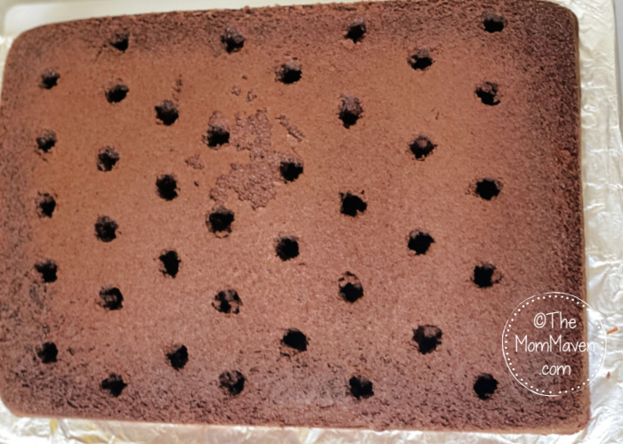 Peppermint Hot Cocoa Cake with holes poked